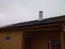 Pokládka střešní krytiny a výstavba komína